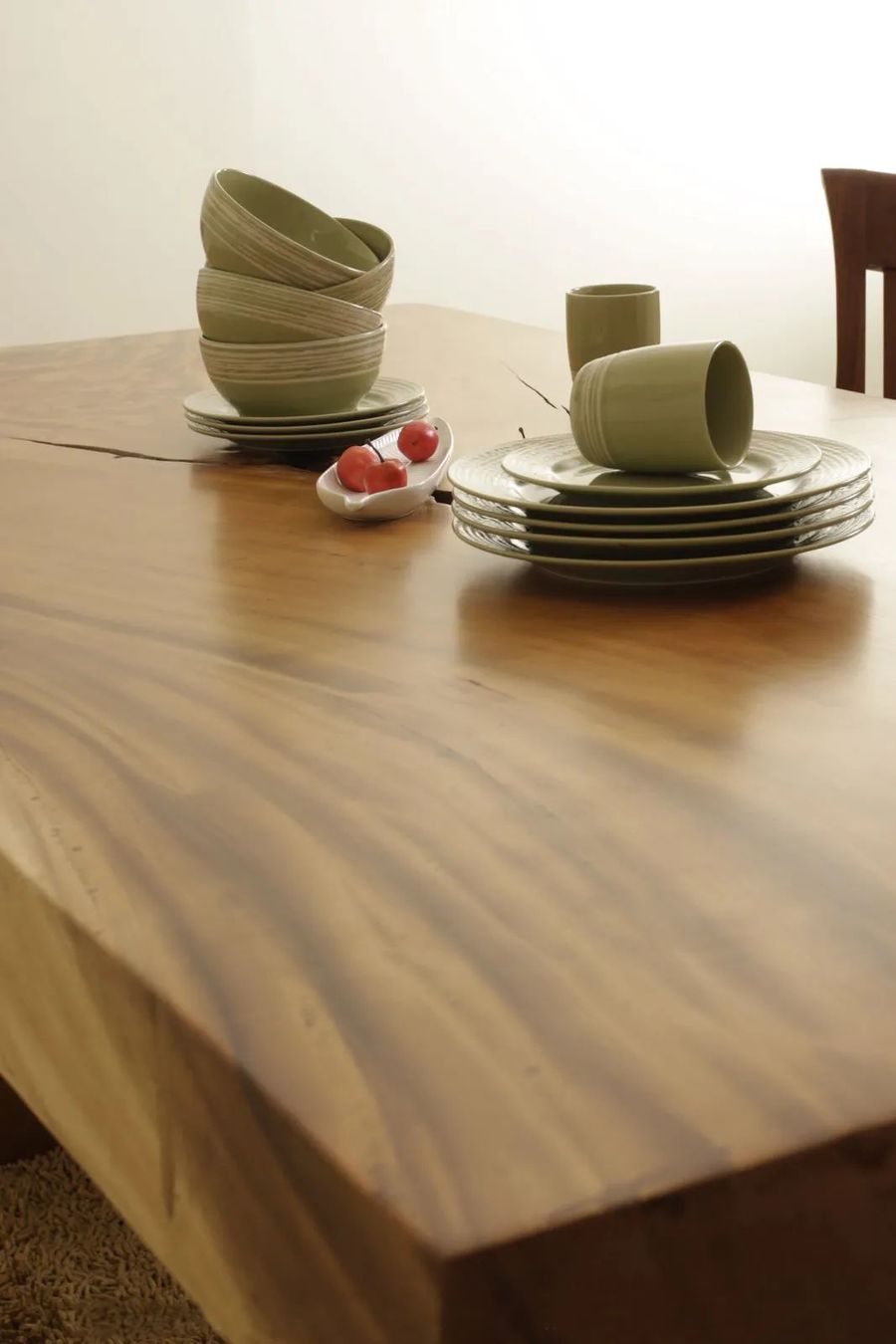 Cross grained detail on the top of Live edge single block solid wood slab dining table